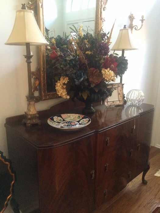 Lovely antique buffet/server; floral arrangement; matching lamps