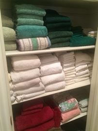 Many towels, sheets, and other linens