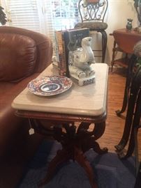 Antique marble top table; elephant book ends