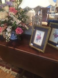Drop leaf table and framed floral pictures