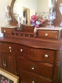 Bedroom dresser with oval mirror