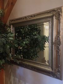 One of several framed mirrors