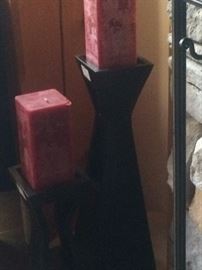 Red square candles and black candle holders