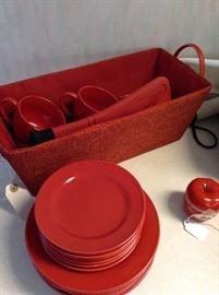 Red lot of dishes, basket and oven mit