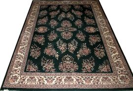 Lot#44, KARABAUGH, PERSIAN, HAND WOVEN WOOL CARPET, W 8' 10", L 12' 3" Having seven borders, forest green ground with floral bouquets throughout the field.