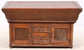 Lot#95, CONTINENTAL HAND CARVED OAK CHEST, 18TH C., H 20", W 46", D 20"Flemish pine chest/trunk with a small dough board top with lid tapering to a smaller chest with hinged cabinet doors with handles.