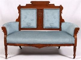 Lot#105, AMERICAN EASTLAKE STYLE WALNUT SETTEE, CIRCA 1900, H 41", W 57"Having inset upholstered back panels and a stylized carved back splat.  Measures H.41" x 57" x 26".