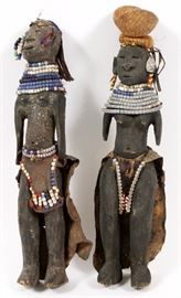 Lot#135, AFRICAN CARVED WOOD FIGURES, 2 PIECES, H 15"Including two carved wood figures, each is decorated with animal hides and shell and color bead necklaces.