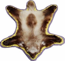 Lot#281, WOLVERINE, FULL SKIN RUG,With head, tail, legs, dark brown to beige, sewn into a maize/blue felt liner, 46" L x 35" W.  Estate of Frederick C. Matthaei, Jr.