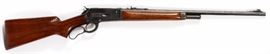 Lot#334, WINCHESTER, .348 CAL. PRE-WAR, MODEL 71, #15030 (1929), L 24" BBL. Winchester pre-war, c1929, .348 cal., lever action rifle. Having a non-checkered  walnut stock and forearm with mounts for shoulder straps rings (only one ring). Checkered steel butt plate. Front iron sight on 24" barrel. 4-round magazine capacity.