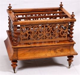 Lot#353, VICTORIAN BURL WALNUT MAGAZINE RACK, H 21 1/2", W 16", L 24 3/4"A Victorian burl walnut magazine rack. Late 19th/early 20th century. Of rectangular form, with three divisions raised on spindles, the base having one drawer, and raised on lobed and tapered feet ending in casters. Height 21 1/2", length 24 3/4", width 16".