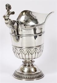 Lot#1046, BIRMINGHAM, ENGLAND STERLING WATER PITCHER, 1920 H 12", W 10.5",A sterling silver water pitcher, having a female figurehead form handle, and a mask medallion at the center of the spout all above a gadrooned flared foot.  Marked at the handle with manufacturer's mark, date letter 'V' indicating 1920.  Weighs 35.59 troy ounces.  B & S Ltd. Birmingham, England. Estate of Frederick C. and Malora Matthaei.