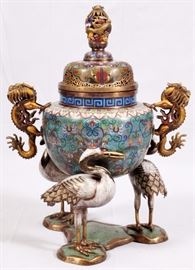 Lot#1080, CHINESE CLOISONNE INCENSE BURNER, MAGNUM SIZE H 34 1/2", W 26"Cloisonee and gilt metal. Crane form legs and serpent form handles.