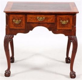 Lot#1095, CHIPPENDALE MAHOGANY LOWBOY, C. 1740-60, H 28", W 29", D 18"Honduras mahogany, burl walnut and oak as secondary wood.  Cabriole carved legs in acanthus motif. Herringbone veneer. Gifted to Edward Cook (great grandfather of consignor) furniture cabinet maker to British royal family from 1930 - 1960.