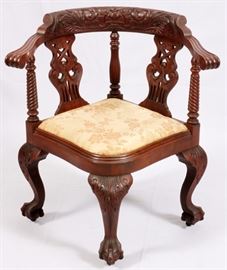Lot#1108, CHIPPENDALE STYLE MAHOGANY CORNER CHAIR, C. 1920, H 31", W 30"Having hand carved spiral columns, two pierced back splats, an upholstered seat, raised on acanthus-carved cabriole legs ending in claw-and-ball feet.