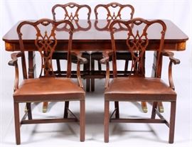 Lot#1110, BERKEY & GAY REVIVAL MAHOGANY DINING SUITE, C. 1940, 6 PIECES. Berkey & Gay, Grand Rapids, 1940's. Comprising: (1) Regency-style dining table with fruitwood inlay to skirt, raised on splayed legs, with (3) additional leaves. H 29.5", L 68.25", D 44"; and (5) Chippendale-style arm chairs, bearing paper label to undersides, H 37", L 19".