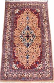 Lot#1186, PERSIAN SAROUK WOOL CARPET, 1990-00, 5' X 3'A peachy-orange ground with accents in blue, green, red, pink, and cream.