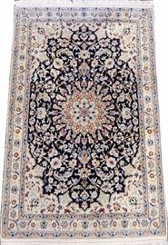 Lot#1194, VERY FINE WOOL AND SILK NAIN RUG, C.1980-90, 4' 1" X 2' 8"  A black center ground with cream and beige floral borders all around.