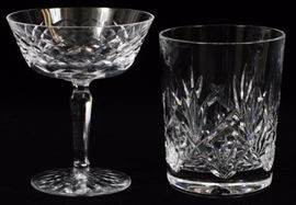 Lot#1281, WATERFORD 'TYRONE' CRYSTAL STEMWARE, 24 PIECES. Including in 'Tyrone' pattern, 13 champagne glasses, 7 old fashioned glasses, H.3 1/2"; together with 4 other Waterford double old fashioned glasses, H.4 1/2".  All marked at the undersides.  With one original box.