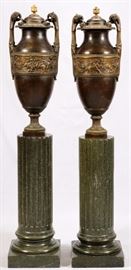 Lot#2016, SIOT DEAUVILLE FOUNDRY, FRENCH BRONZE URNS, PAIR, H 37 1/2", W 14", MARBLE PEDESTALS 33" A pair of French bronze urns with chariot scenes in the central friezes, having double handles, lids, and set on green marble fluted pedestals.  The pedestals measure H.36" x 15 1/2".  Marble columns are 33" high. Overall H.73".