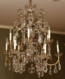 Lot#2232, DODGE ESTATE FRENCH CRYSTAL & BRASS TWELVE-LIGHT CHANDELIER, H 40", DIA 33" Ex: Anna Thomson Dodge, Rose Terrace, Grosse Pointe, MI.  Accented with crystal prisms and bobeches . From the estate of D. J. Kennedy, Grosse Pointe, Mi.