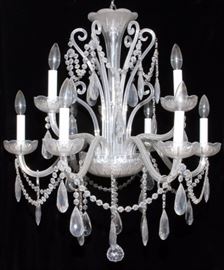 Lot#2237, EIGHT-LIGHT CRYSTAL CHANDELIER, H 27", DIA 23" The crystal chandelier has eight scroll arms, two tiers, crystal central shaft, swags and prisms.