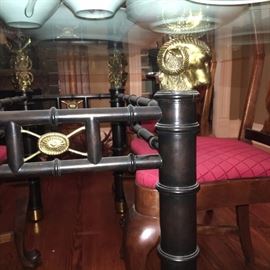 Iron and brass ram's heads base for lovely glass dinning table