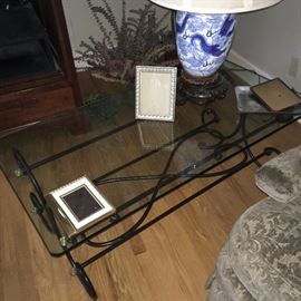 Iron and brass based table with glass top