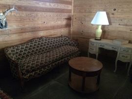 Feather sofa; French Provincial ladies desk; circular occasional table.