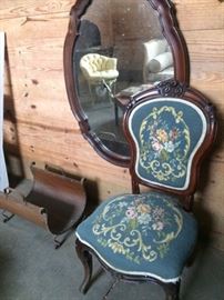 Needlepoint rosewood chair; copper fire holder; oval mirror.