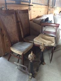 Two of four cane back dining chairs; pair andirons.