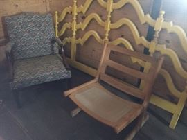 Oak low seated chair; Yellow painted king headboard; upholstered open arm chair.