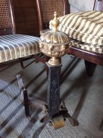 Close up of black painted and gilt andiron