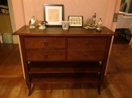 Small sideboard with two drawers, one door and two shelves.