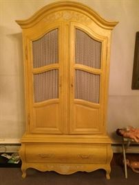 Country French entertainment cabinet with three interior drawers.
