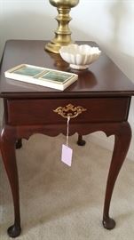 One of pair of mahogany end tables