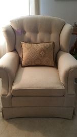 One of pair of cream colored windback chairs