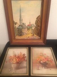 Oil painting of a European city and two vintage floral prints.