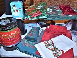 Many Christmas linens, ribbons, bows, rolls of wrapping paper and much more!
