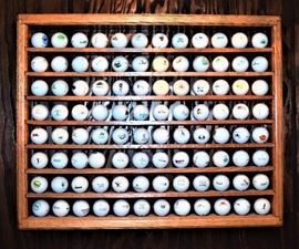 Golf balls with display cabinet