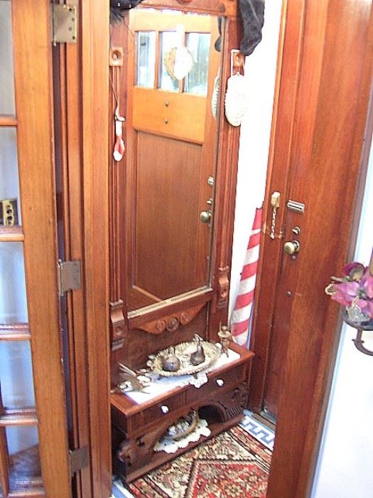 Victorian pier mirror at home entrance. Hard to get a good photo. It is in excellent condition and of walnut. Circa about 1875.
