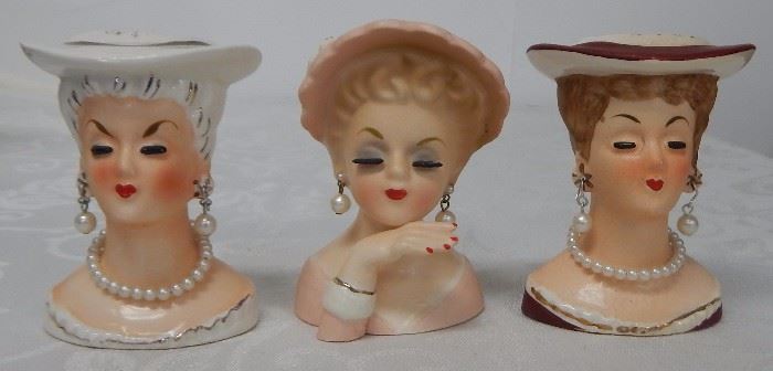 Three mini head vases.