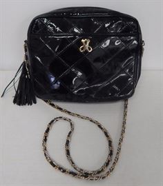 Jay Herbert black quilted patent leather bag on woven chain.