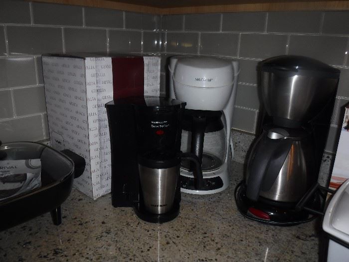 4 COFFEE MAKERS.