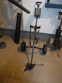GOLF BAG CART.   WE DO HAVE SOME GOLF CLUBS TOO,