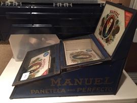 Assortment of antique cigar collectibles. 