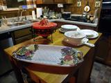 Center Portable Working Island loaded w/storage....Serving Pieces,
Pyres, Assorted dishes, bowels, etc., etc...