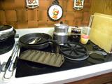 Assorted Cast Iron Pieces...Come take a look and many items are like
brand NEW....