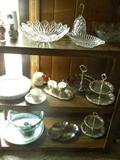 Shelves and shelves of glassware, silver server, stainless steel servers,
Pitcher & matching bar set, Assorted decorative plate collection.,
Lenox decorator items, Cake plates, Relish Dishes, Great Assortment of
items just waiting to be purchased...