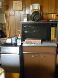 Kenmore Trash Compactor, Storage Cabinet, 2 Microwaves, Assorted
Kitchen Items....